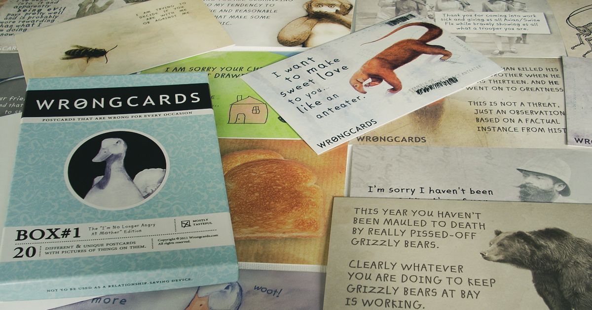A scattered pile of amusing postcards